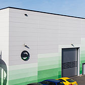 Hallenkonstruktion für Muehlhause von Schreiber Stahlbau mit farblich abgesetzter Attikaabdeckung aus Aluminium